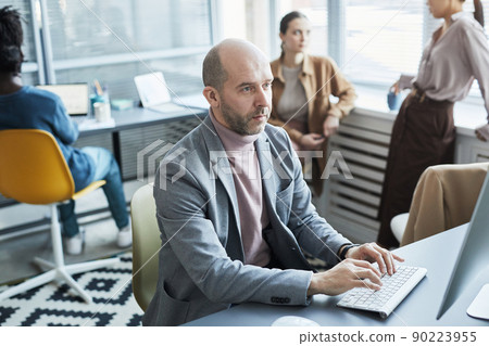 Adult Office Worker using Laptop 90223955