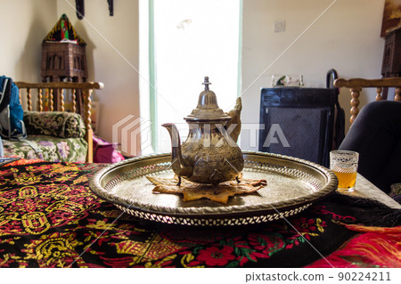 A silver pot for Moroccan mint tea and a decorated tray in Marrakech, the city of Morocco 90224211