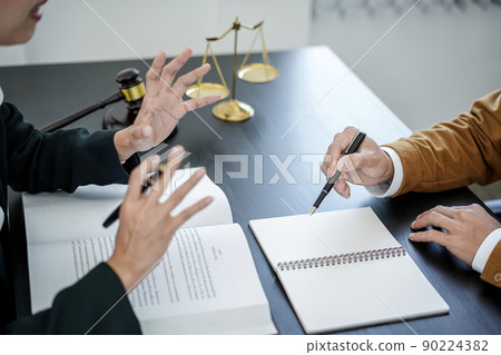 Male lawyer or notary working consulting and discussion to businesswoman client in the office, Law and Legal services concept 90224382