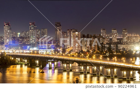 Kyiv (Kiev) city, the capital of Ukraine at night beside the Dnipro (Dniepr) river with reflection in water Kyiv (Kiev) city, the capital of Ukraine at night beside the Dnipro (Dniepr) river with reflection in water 90224961
