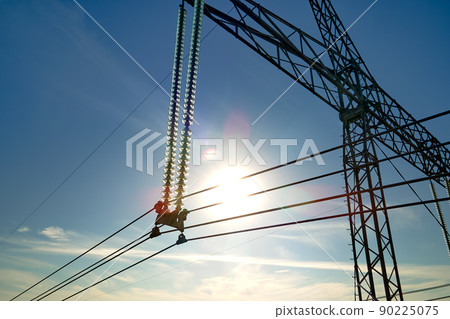 High voltage insulation string on steel pillar with electric power lines for safe delivering of electrical energy through cable wires on long distance High voltage insulation string on steel pillar with electric power lines for safe delivering of electrical energy through cable wires on long distance 90225075
