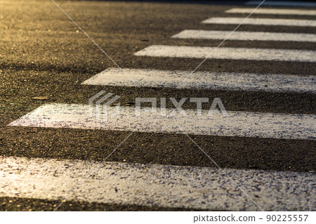 Detail of dangerous road crossing with pedestrian zebra. Safety concept. 90225557