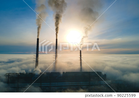 Coal power plant high pipes with black smoke moving upwards polluting atmosphere. Production of electrical energy with fossil fuel concept Coal power plant high pipes with black smoke moving upwards polluting atmosphere. Production of electrical energy with fossil fuel concept 90225599
