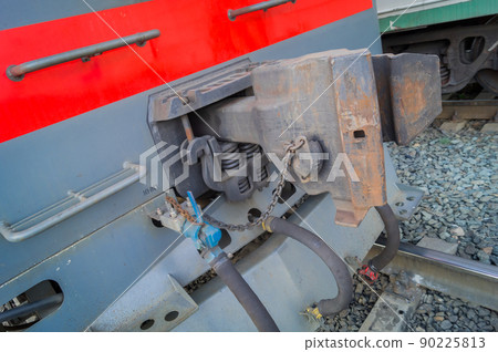 Coupler of a freight railway electric locomotive. The mechanism of adhesion of train cars. Device for connecting trailers on the railway. Selective focus Coupler of a freight railway electric locomotive. The mechanism of adhesion of train cars. Device for connecting trailers on the railway. Selective focus 90225813