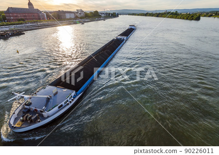 Cargo ship with coal bulk load on the river Rhine in Mainz, Germany 90226011