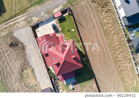Aerial view of residential house with backyard in suburban rural area Aerial view of residential house with backyard in suburban rural area 90226432