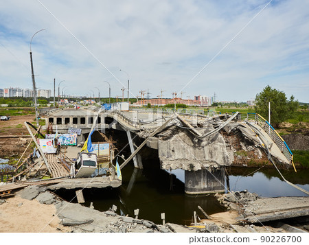 Irpin, Ukraine - 28 May 2022: Destroyed bridge in Irpin near Kyiv. Irpin, Ukraine - 28 May 2022: Destroyed bridge in Irpin near Kyiv. 90226700