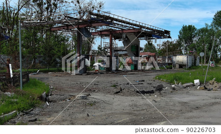 Irpin, Ukraine - May 15, 2022: Destroyed buildings on the streets of Irpen. Irpin, Ukraine - May 15, 2022: Destroyed buildings on the streets of Irpen. 90226703