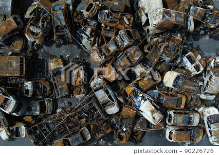 A lot of rusty burnt cars in Irpen, after being shot by the Russian military. A lot of rusty burnt cars in Irpen, after being shot by the Russian military. 90226726