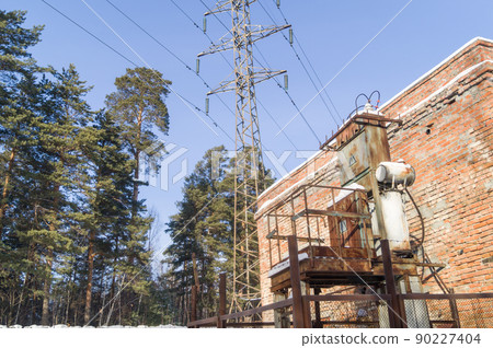Old high-voltage transformer of city power supply. Rusty equipment of the power plant. Selective focus Old high-voltage transformer of city power supply. Rusty equipment of the power plant. Selective focus 90227404