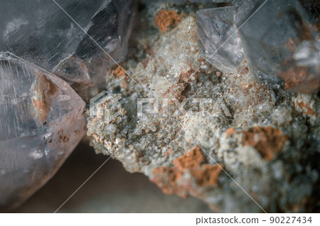 A sample of rock with amethyst under great magnification. Mountain mineral with crystals. Macro, horizontal composition 90227434