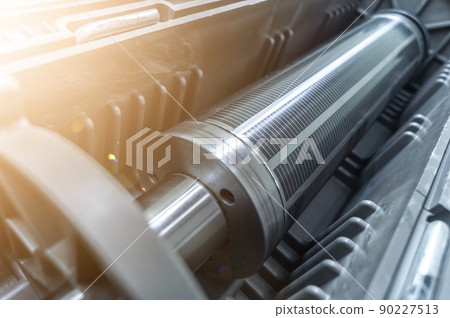 Used magnetic cylinder for rotary printing machine in plastic box. Magnetic shaft for die mounting. Selective focus 90227513