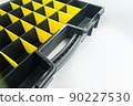 Empty box with cells for storing small parts and fasteners. Sectional tool box. Organizer. Selective focus 90227530