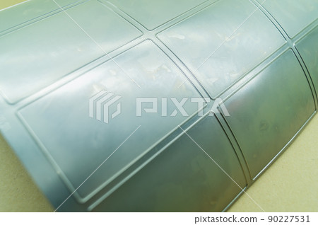 Die-cut die for magnetic cylinder printing press. Die-cutting of labels. Cut knife for paper labels. Rotary stamp. Offset cutting knife for printing machine. Selective focus Die-cut die for magnetic cylinder printing press. Die-cutting of labels. Cut knife for paper labels. Rotary stamp. Offset cutting knife for printing machine. Selective focus 90227531