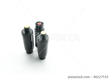 Aerosol pepper cartridges for a protective gun. Means of self-defense against attacks by aggressive people and animals. Selective focus, isolated on white, copy space Aerosol pepper cartridges for a protective gun. Means of self-defense against attacks by aggressive people and animals. Selective focus, isolated on white, copy space 90227533
