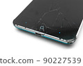 Smartphone with broken display glass. Cracked screen glass. Broken phone. Selective focus 90227539