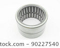 Needle bearing on a white background. Roller bearing for motors, machinery and equipment. Spare part. Selective focus, isolated on white 90227540