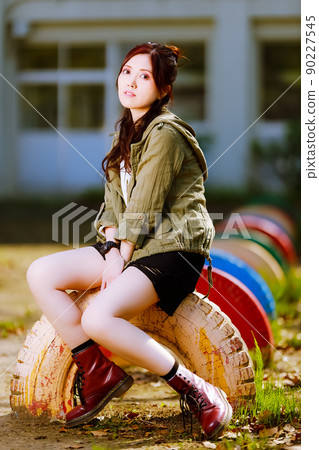 Cute female portrait with playset of closed elementary school Cute female portrait with playset of closed elementary school 90227545