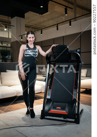 female athlete prepare for training with treadmill 90227557