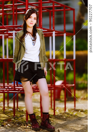 A cute female portrait at a closed elementary school jungle gym A cute female portrait at a closed elementary school jungle gym 90227707