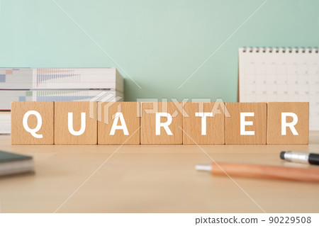 Image of quarter-quarter | Desk with building blocks with "QUARTER" written on it Image of quarter-quarter | Desk with building blocks with "QUARTER" written on it 90229508