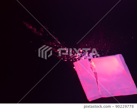 A photo of a suspicious atmosphere reminiscent of drugs with white powder and a medicine bag A photo of a suspicious atmosphere reminiscent of drugs with white powder and a medicine bag 90229778