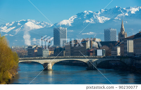 Grenoble with cable car against backdrop of snowy Alps Grenoble with cable car against backdrop of snowy Alps 90230077