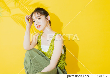 Summer woman yellow background Summer woman yellow background 90230997