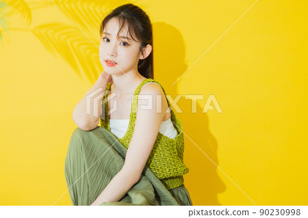 Summer woman yellow background Summer woman yellow background 90230998