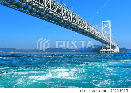 Onaruto Bridge and whirlpools under clear skies 90231615
