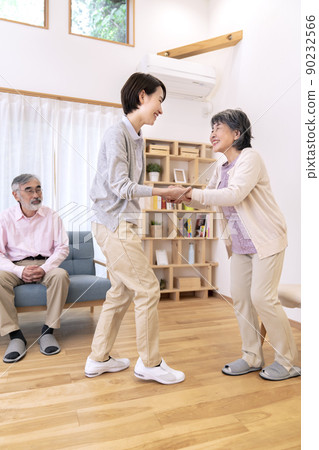 Caregiver caregiving image to assist walking 90232566