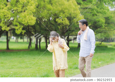 Active senior walking couple Active senior walking couple 90232955