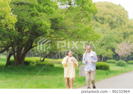 Active senior walking couple Active senior walking couple 90232964