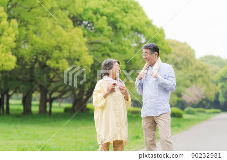 Active senior walking couple 90232981