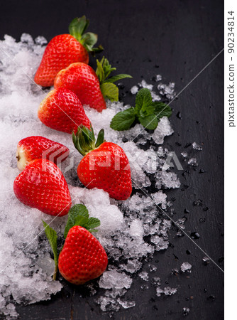 Strawberries, mint and iceon the black background Strawberries, mint and iceon the black background 90234814