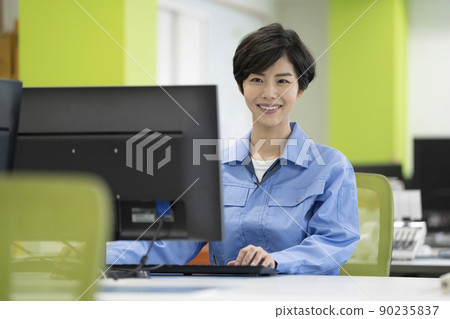 Desk work Young woman in work clothes Desk work Young woman in work clothes 90235837