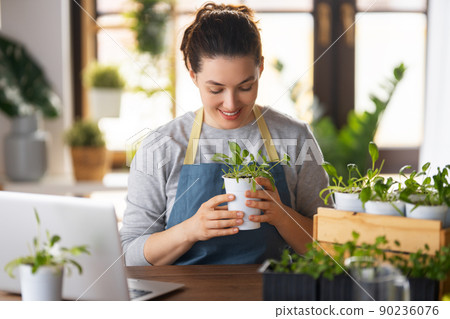 Woman caring for plants 90236076
