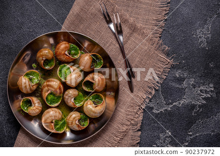 Bourgogne Escargot Snails with herb garlic oil. 90237972