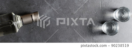 Bottle of vodka. Vodka in glass glasses. Horizontal photo. Copy space 90238519