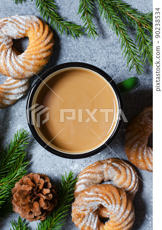 Hot chocolate in a metal mug. Green Christmas tree branches, pine cones. Flat Lay Hot chocolate in a metal mug. Green Christmas tree branches, pine cones. Flat Lay 90238534