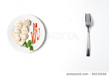 Traditional Russian dumplings, ravioli, pelmeni on a white plate with red sauce and parsley. White background. Top view. Copy space 90238566