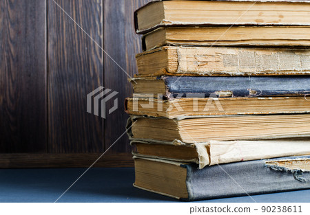 Old books with crumpled, torn covers. Copy space 90238611