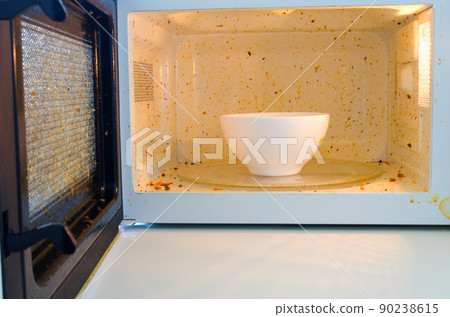 Open microwave. Dirt from food inside Open microwave. Dirt from food inside 90238615