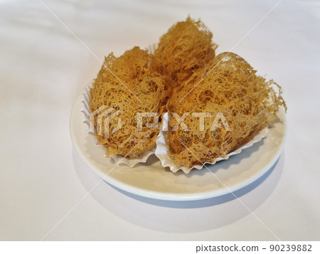 Deep-fried golden crispy hot taro dumplings in Yum Cha Chinese restaruant on white dish Deep-fried golden crispy hot taro dumplings in Yum Cha Chinese restaruant on white dish 90239882