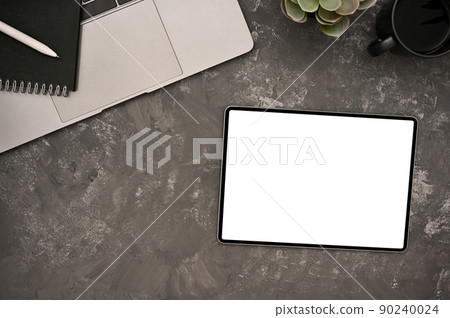 Hipster workspace top view with digital tablet mockup on rustic grey table background. 90240024