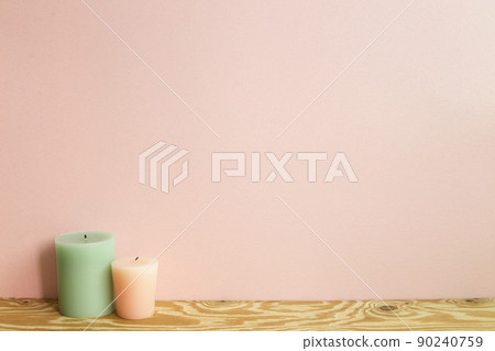 Candles on wooden table. pink wall background 90240759