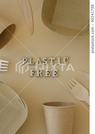 PLASTIC FREE text around Eco friendly, disposable, recyclable, compostable tableware. Paper food boxes, dishes on neutral beige background. Sustainable lifestyle concept. Flat lay PLASTIC FREE text around Eco friendly, disposable, recyclable, compostable tableware. Paper food boxes, dishes on neutral beige background. Sustainable lifestyle concept. Flat lay 90241786