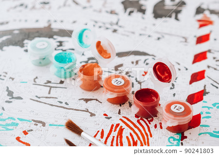 Acrylic paints on numbered canvas. Picture by numbers. Creative hobby. Painting for beginners. Hobbies for stay home lockdown, anti-stress idea. Meditation, relax concept education. Leisure activity. 90241803