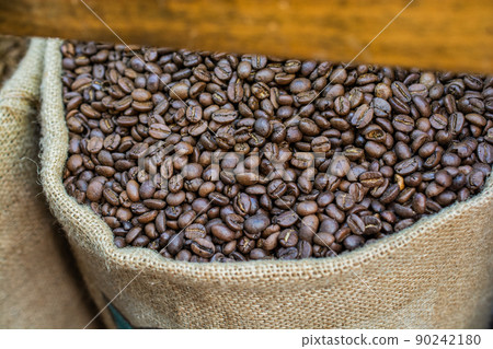 Coffee beans ready for the grinder background 90242180