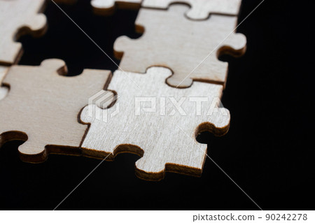 Pieces of jigsaw puzzle as business strategy concept Pieces of jigsaw puzzle as business strategy concept 90242278